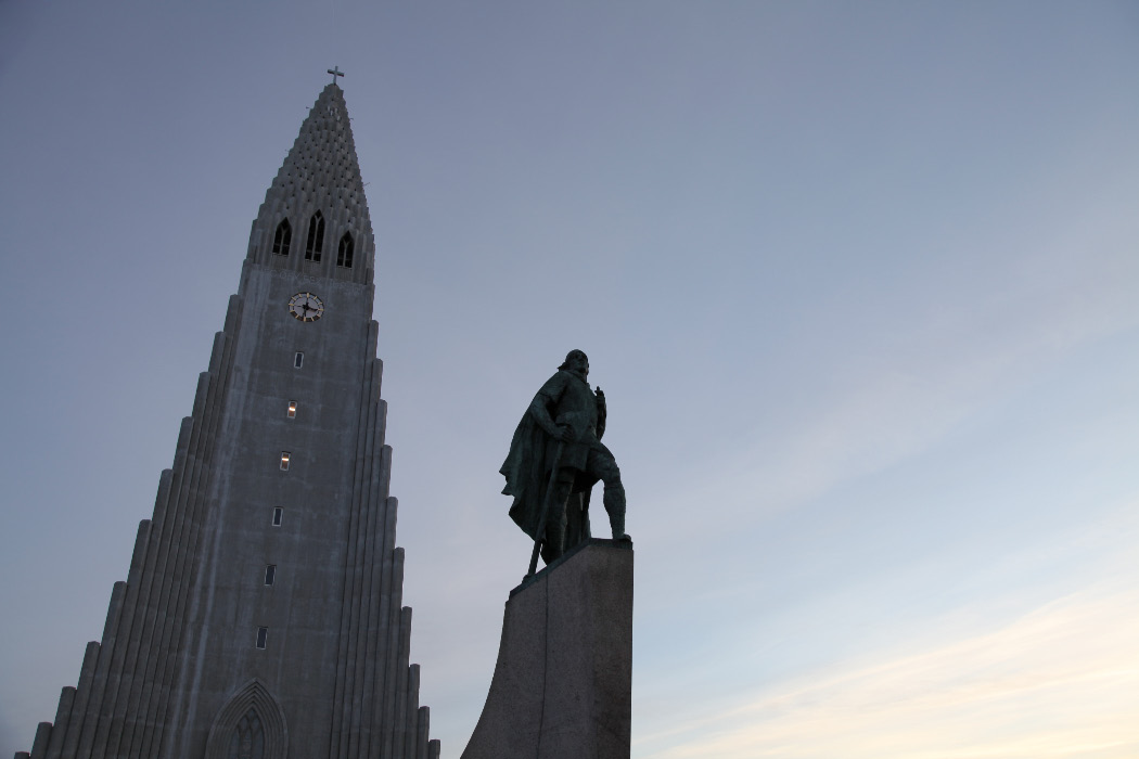 Hallgrímskirkja and Leifr Eiríksson sculpture by A.S. Calder with Cross and in chainmail with sword and battleaxe —  the Old Evangelization