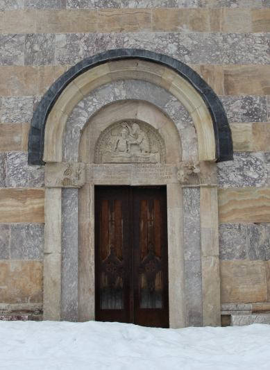 Side portal at Monastery Visoki Dečani in Kosovo with tympanum depicting the baptism of Christ Jesus and with lintel honoring Fra Vita